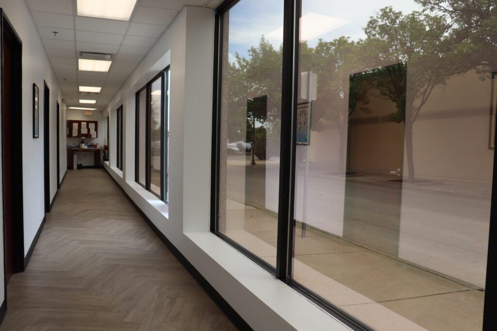 a hallway with large windows