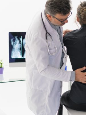 Physical Doctor consulting with patient about Back problems Physical therapy